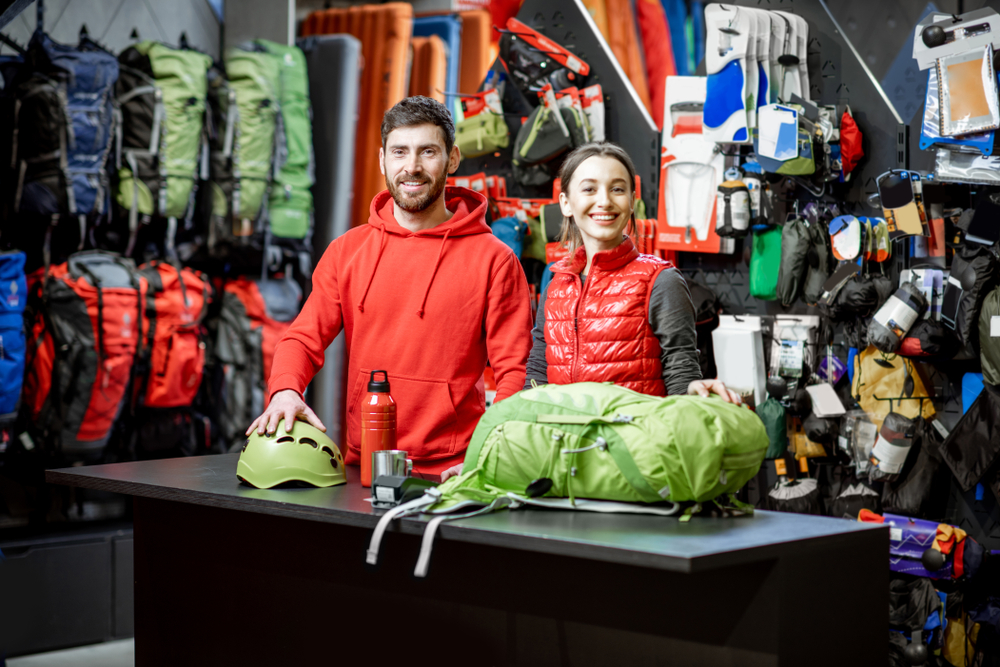 man and woman at outdoor retail store